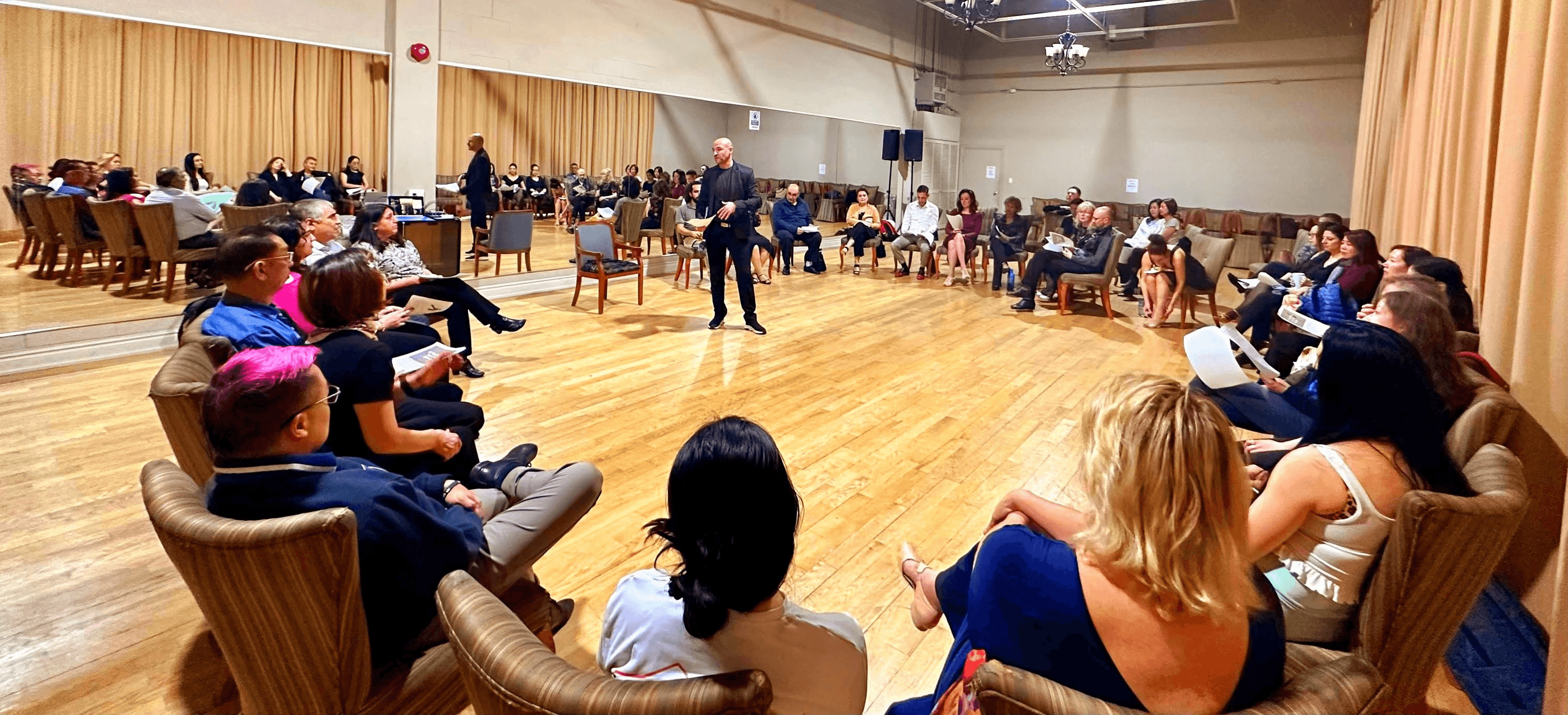Tango Pi instructor leading a welcoming class conversation at DanceMania